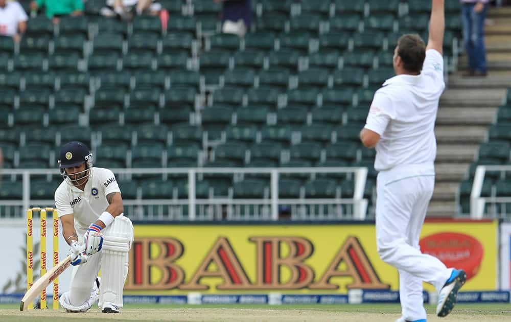 Virat Kohli is dismissed by South Africa's bowler Jacques Kallis during the first day of their cricket test match against South Africa at Wanderers stadium in Johannesburg, South Africa.