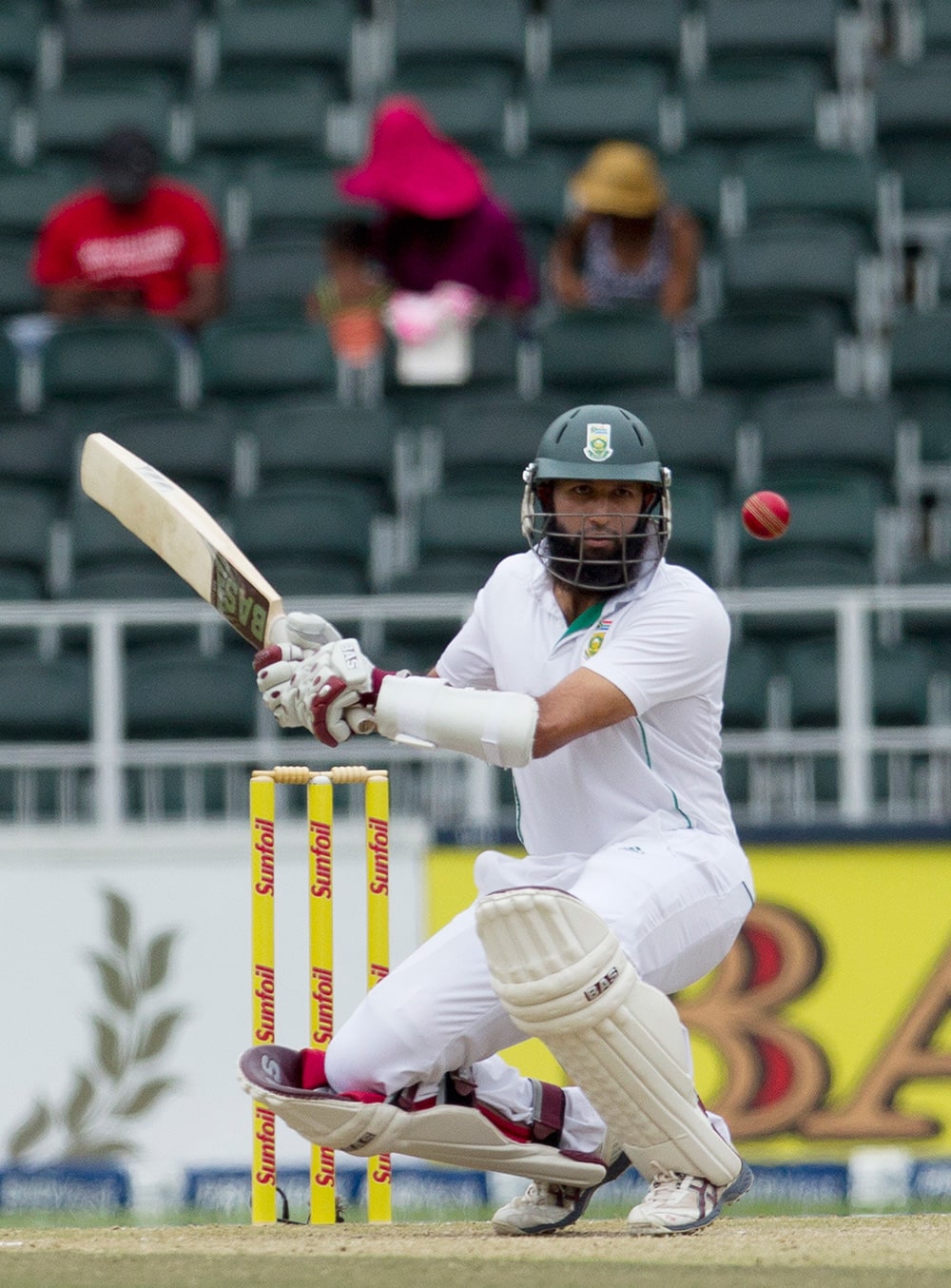 South Africa's Hashim Amla avoids a bouncer from India's bowler Mohammad Shami during the second day of their cricket test match at Wanderers stadium in Johannesburg, South Africa.