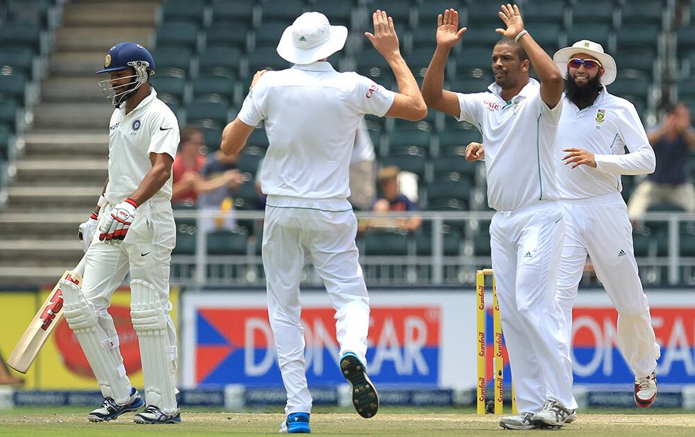 Shikhar Dhawan leaves the field after he was dismissed by South Africa's bowler Vernon Philander for 15 runs during India's 2nd innings on the third day of their cricket test match at Wanderers stadium in Johannesburg, South Africa.