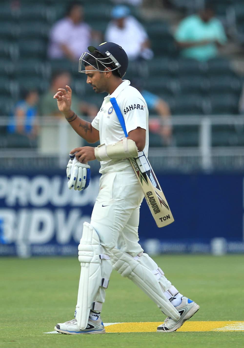 Murali Vijay reacts as he walks back to the pavilion after his dismissal during their 2nd innings on the third day of their cricket test match against South Africa at Wanderers stadium in Johannesburg, South Africa.