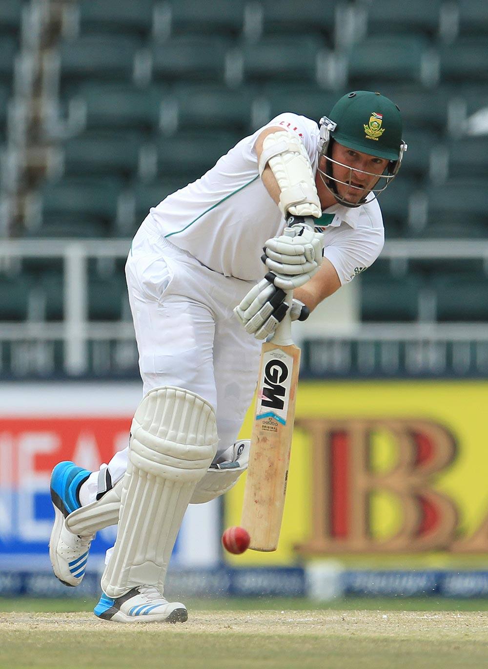 South Africa's captain Graeme Smith plays a shot during their second innings on the fourth day of their cricket test match against India at Wanderers stadium in Johannesburg.