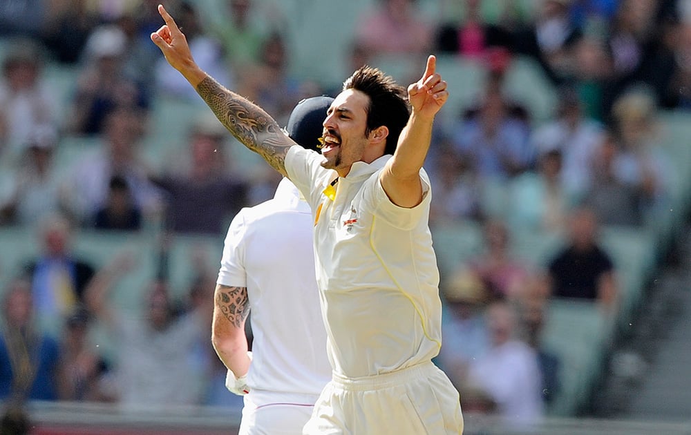 Australia's Mitchell Johnson celebrates the wicket of England's Ben Stokes on the first day of their Ashes cricket test match at the Melbourne Cricket Ground in Melbourne, Australia.