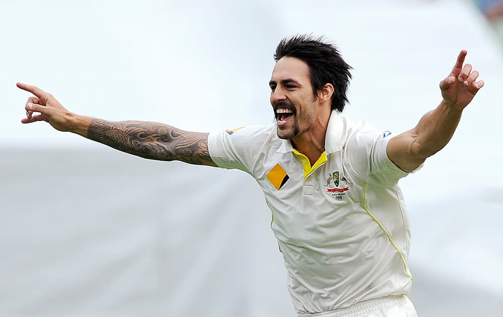 Australia's Mitchell Johnson celebrates the wicket of England's Tim Bresnan for 1 run during their Ashes cricket test match at the Melbourne Cricket Ground in Melbourne, Australia.