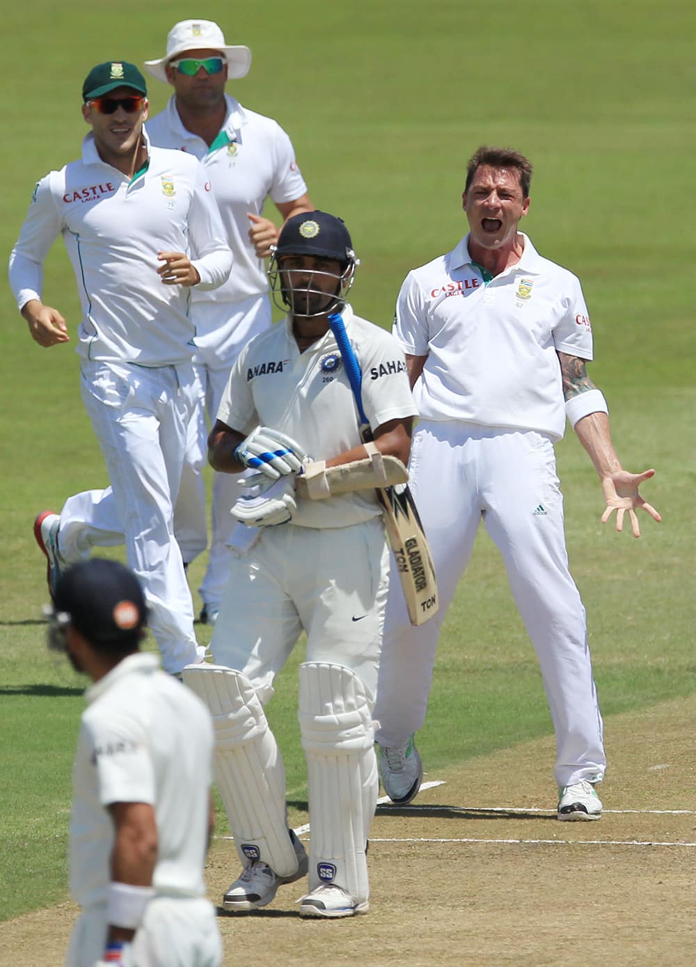 Dale Steyn reacts after dismissing Murali Vijay for 97 runs during second day of their cricket test match at Kingsmead stadium, Durban, South Africa.