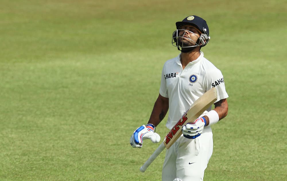Virat Kohli leaves the field after being dismissed by Morne Morkel, for 46 runs during the second day of their cricket test match at Kingsmead stadium, Durban, South Africa.