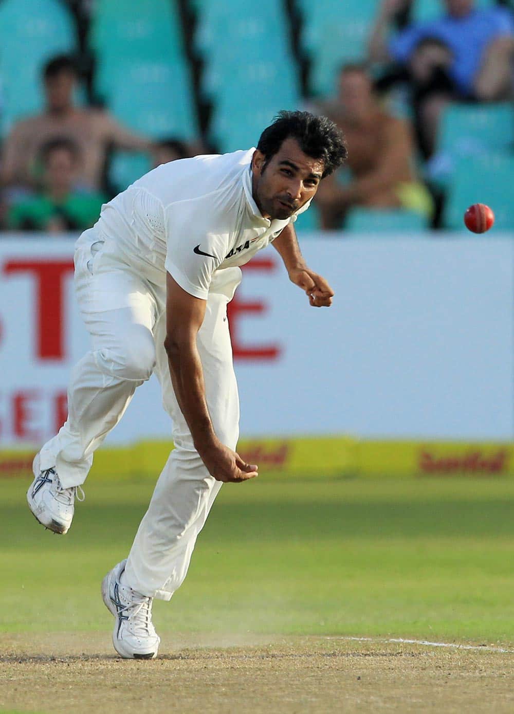 India's bowler Mohammad Shami, follows through his bowling during second day of their cricket test match against South Africa at Kingsmead stadium, Durban, South Africa.