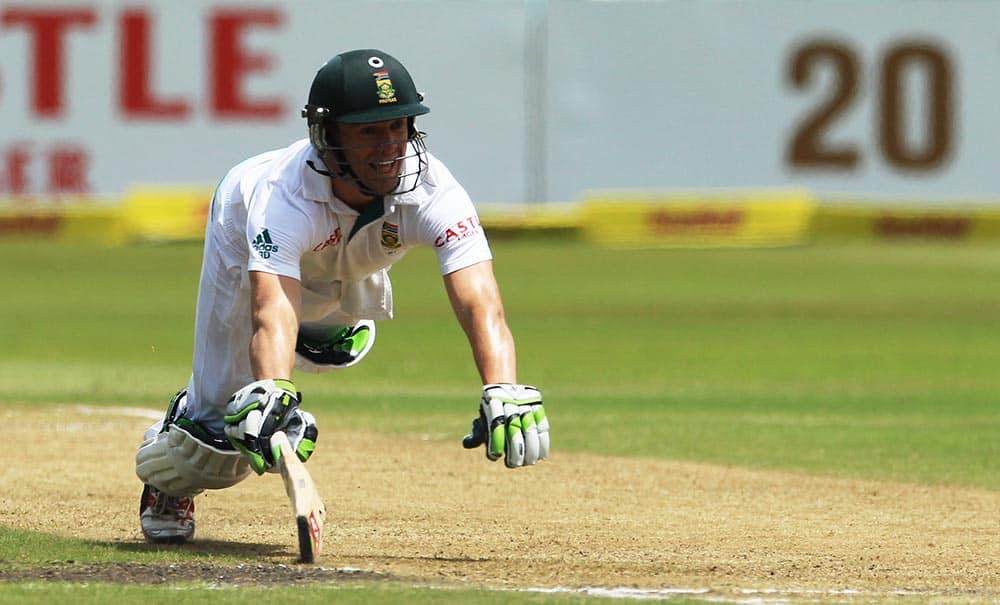 South Africa's batsman Abraham Benjamin de Villiers dives home safely after a run out attempt on the third day of their cricket test match against India at Kingsmead stadium, Durban, South Africa.