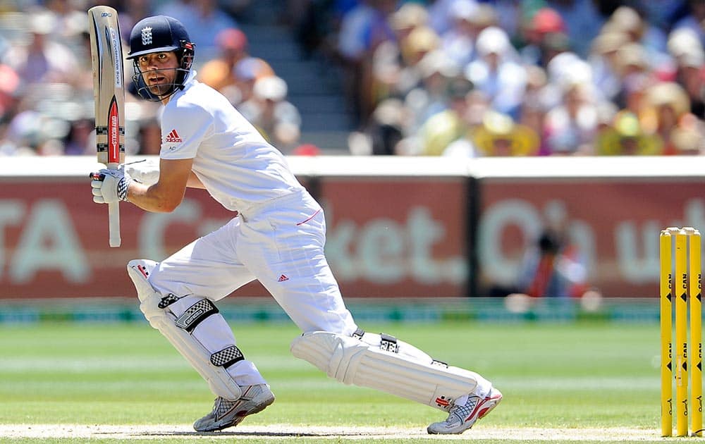 England's Alastair Cook runs between stumps while playing Australia during their Ashes cricket test match, at the Melbourne Cricket Ground in Melbourne, Australia.