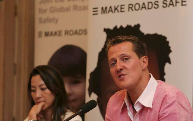 Schumacher speaks as Malaysian actress Michelle Yeoh looks on during a press conference in San Jose in January 2009.