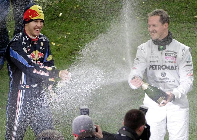 Mercedes F1 driver Michael Schumacher, left, and Red Bull driver Sebastian Vettel celebrate after winning the nations cup at the Race of Champions, in Duesseldorf, western Germany in November 2007.