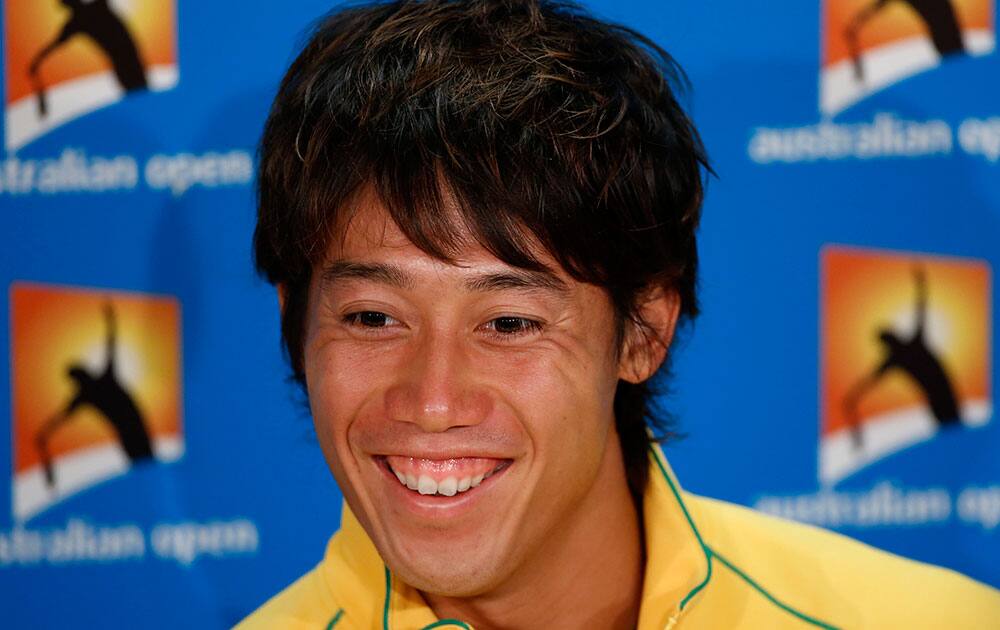 Japan's Kei Nishikori smiles during a press conference at the Australian Open tennis championship.