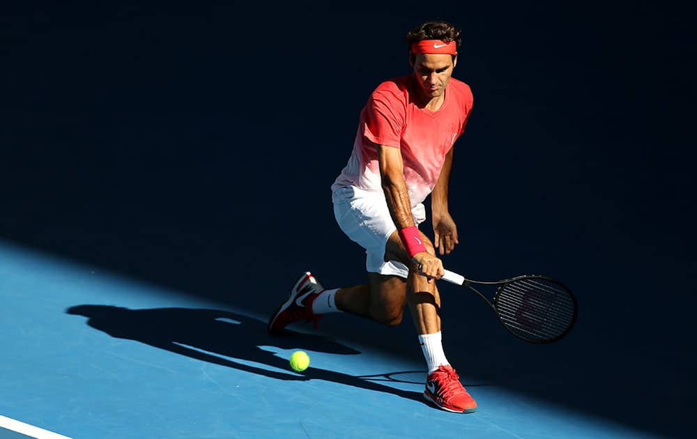 Roger Federer of Switzerland makes a backhand return during a practice session ahead of the Australian Open tennis championship.