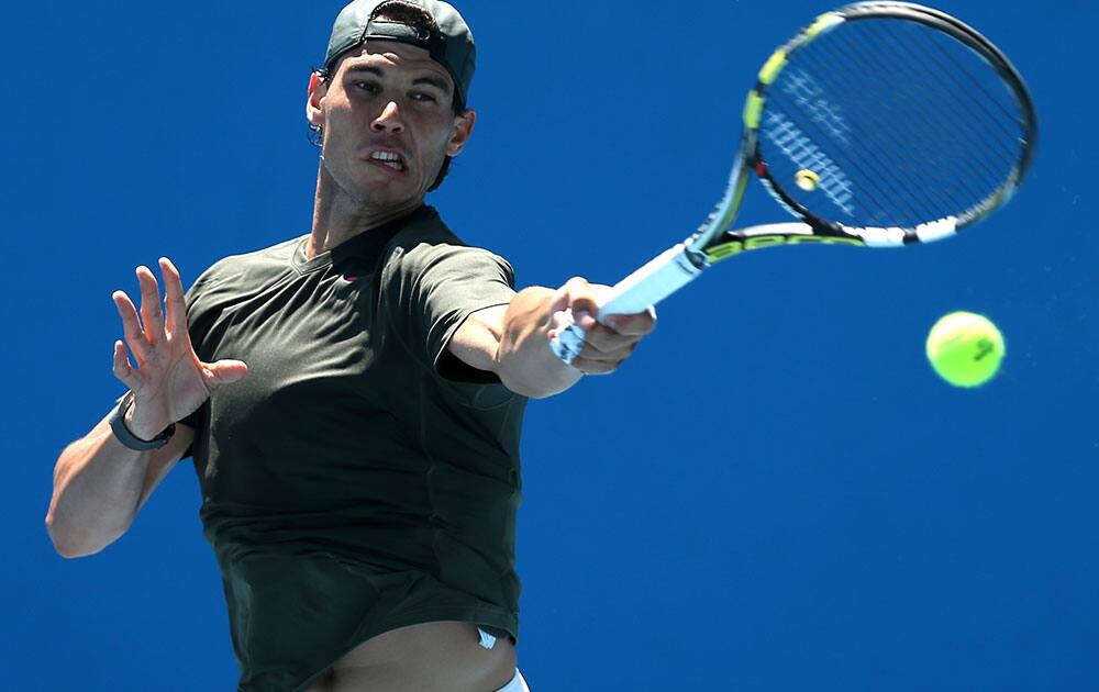 Rafael Nadal of Spain hits a return during a practice session ahead of the Australian Open tennis championship.