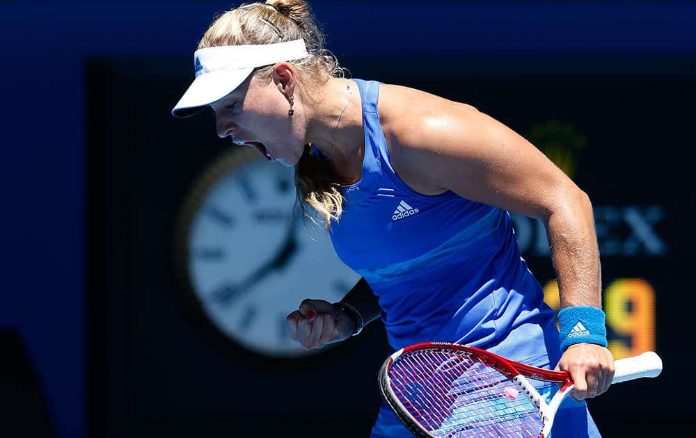Angelique Kerber of Germany reacts after winning a point against Jarmila Gajdosova of Australia during their first round match at the Australian Open tennis championship in Melbourne.