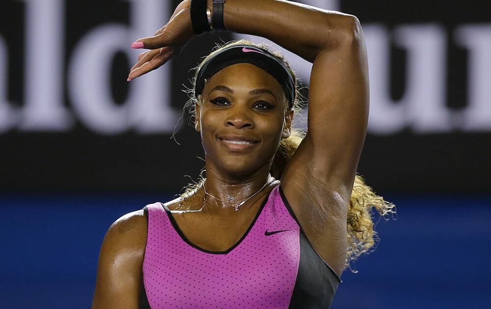 Serena Williams of the United States celebrates after defeating Ashleigh Barty of Australia in their first round match at the Australian Open tennis championship in Melbourne, Australia.