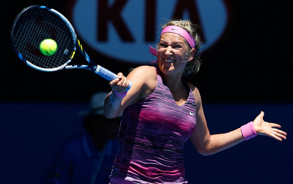 VICTORIA AZARENKA OF BELARUS HITS A FOREHAND RETURN TO JOHANNA LARSSON OF SWEDEN DURING THEIR FIRST ROUND MATCH AT THE AUSTRALIAN OPEN TENNIS CHAMPIONSHIP IN MELBOURNE.