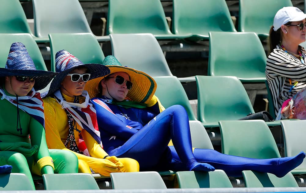 Tennis fans watch the first round match between Camila Giorgi of Italy and Storm Sanders of Australia at the Australian Open tennis championship in Melbourne, Australia.
