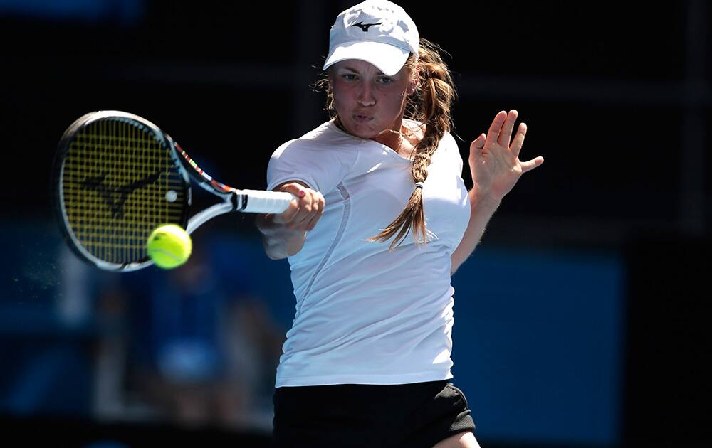 Yulia Putintseva of Kazakhstan returns to Agnieszka Radwanska of Poland during their first round match at the Australian Open tennis championship in Melbourne, Australia.