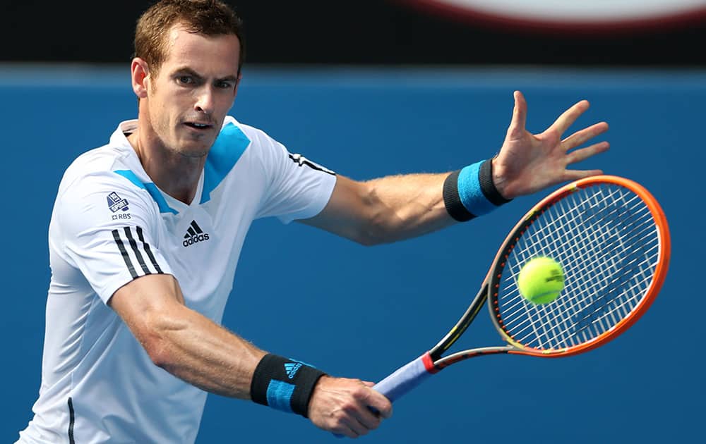 Andy Murray of Britain makes a backhand return to Go Soeda of Japan during their first round match at the Australian Open tennis championship in Melbourne, Australia.