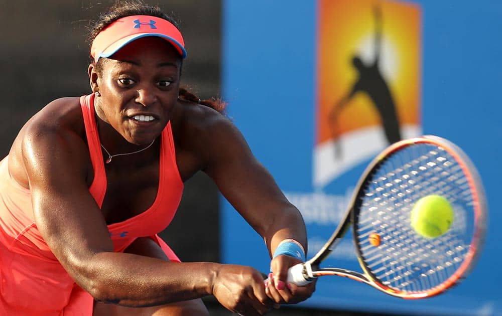 Sloane Stephens of the U.S. makes a backhand return to Yaroslava Shvedova of Kazakhstan during their first round match at the Australian Open tennis championship in Melbourne, Australia.