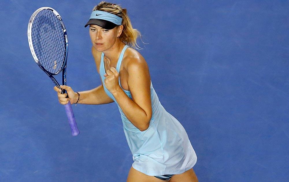 Maria Sharapova of Russia celebrates after winning over Bethanie Mattek-Sands of the US during their first round match at the Australian Open tennis championship in Melbourne, Australia.