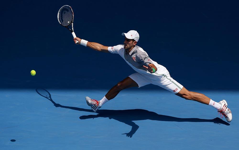 Novak Djokovic of Serbia makes a forehand return to Leonardo Mayer of Argentina during their second round match at the Australian Open tennis championship in Melbourne, Australia.