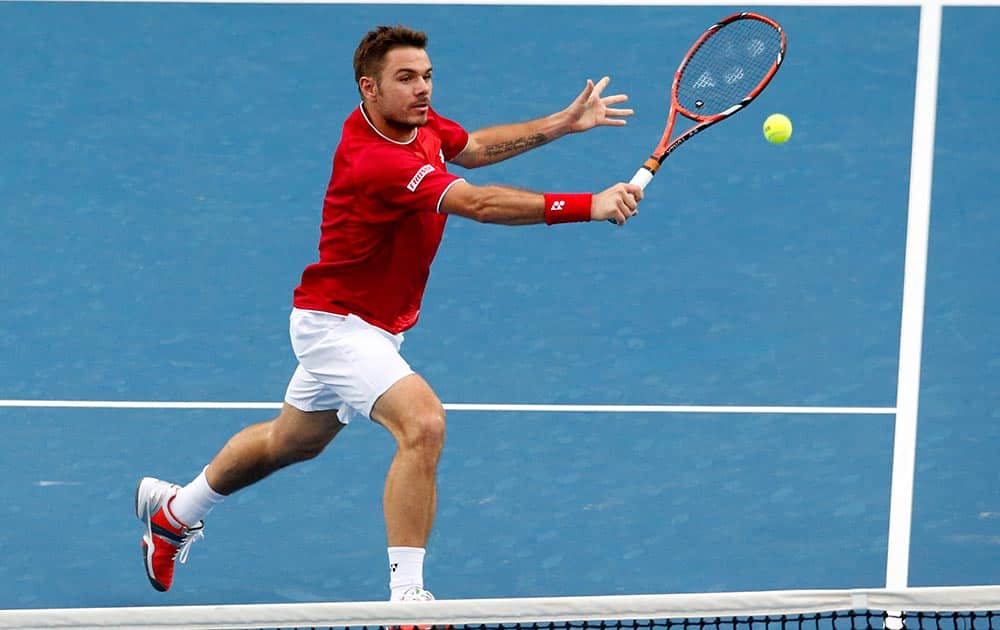 Stanislas Wawrinka of Switzerland makes a backhand return to Alejandro Falla of Colombia during their second round match at the Australian Open tennis championship in Melbourne, Australia.