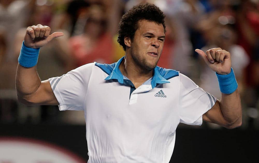 Jo-Wilfried Tsonga of France celebrates after defeating Thomaz Bellucci of Brazil during their second round match at the Australian Open tennis championship in Melbourne.