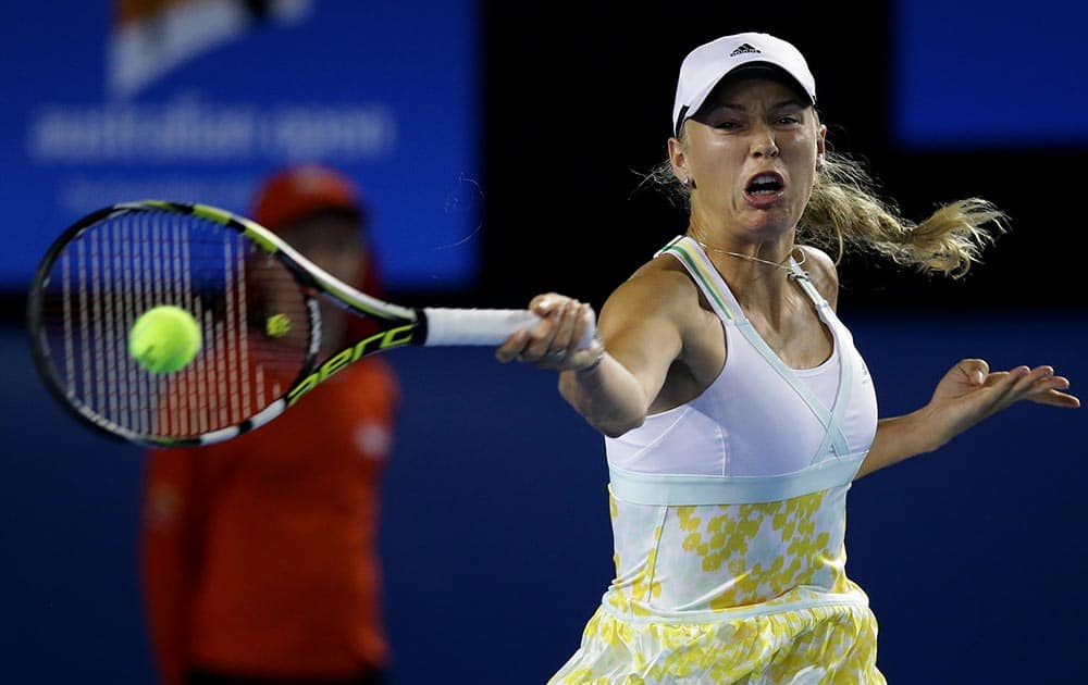 Caroline Wozniacki of Denmark hits a forehand return to Christina McHale of the U.S. during their second round match at the Australian Open tennis championship in Melbourne, Australia.