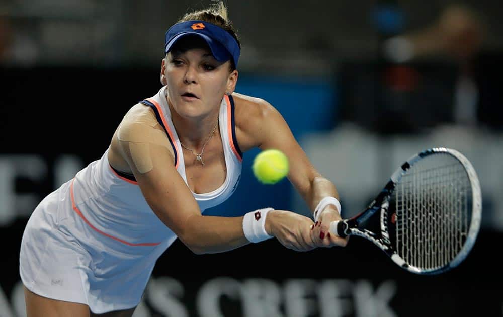 Agnieszka Radwanska of Poland makes a backhand return to Olga Govortsova of Belarus during their second round match at the Australian Open tennis championship in Melbourne, Australia.