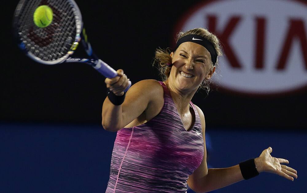 Victoria Azarenka of Belarus hits a forehand return to Barbora Zahlavova Strycova of the Czech Republic during their second round match at the Australian Open tennis championship in Melbourne, Australia.