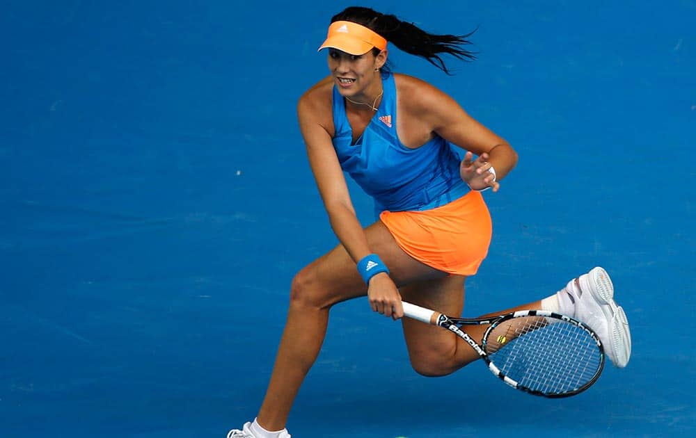 Garbine Muguruza of Spain makes a forehand return to Caroline Wozniacki of Denmark during their third round match at the Australian Open tennis championship in Melbourne, Australia.