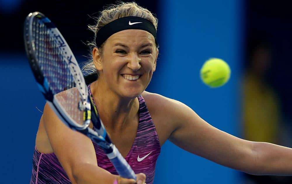 Victoria Azarenka of Belarus hits a forehand return to Yvonne Meusburger of Austria during their third match at the Australian Open tennis championship in Melbourne, Australia.