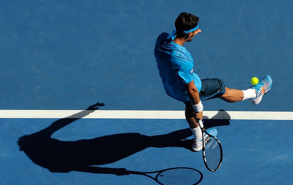 Fabio Fognini of Italy kicks a ball during his fourth round match against Novak Djokovic of Serbia at the Australian Open tennis championship in Melbourne.