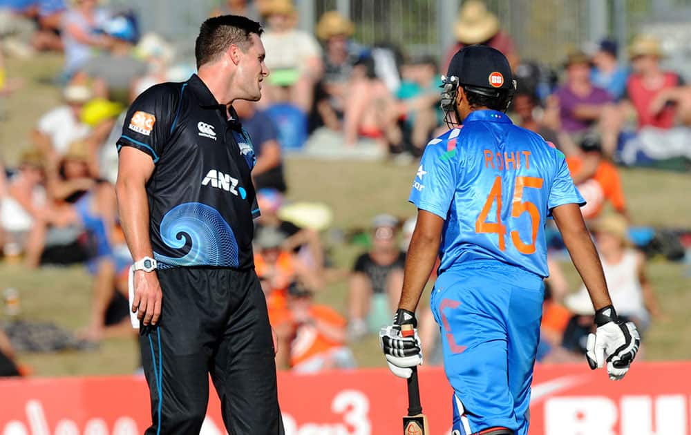 Mitchell McClenaghan, offers India’s Rohit Sharma some batting advice the first one-day international cricket match at McLean Park in Napier.
