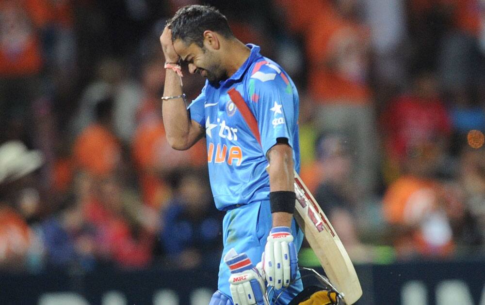 Virat Kohli walks off out for 123 against New Zealand in their first one day international cricket match at McLean Park in Napier.