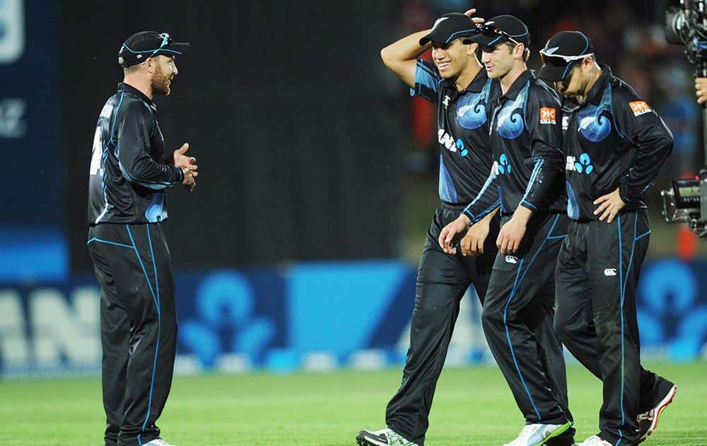 New Zealand's captain Brendon McCullum, left, leads his team members off after their win over India in their first one day international cricket match at McLean Park in Napier.