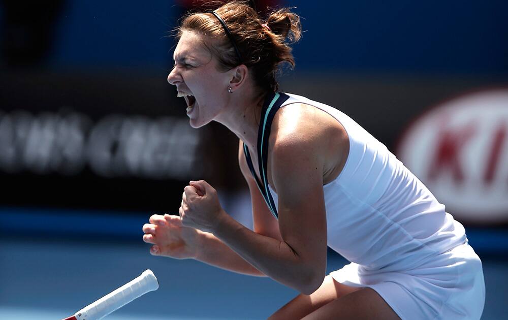 Simona Halep of Romania celebrates after her win over Jelena Jankovic of Serbia during their fourth round match at the Australian Open tennis championship in Melbourne, Australia.