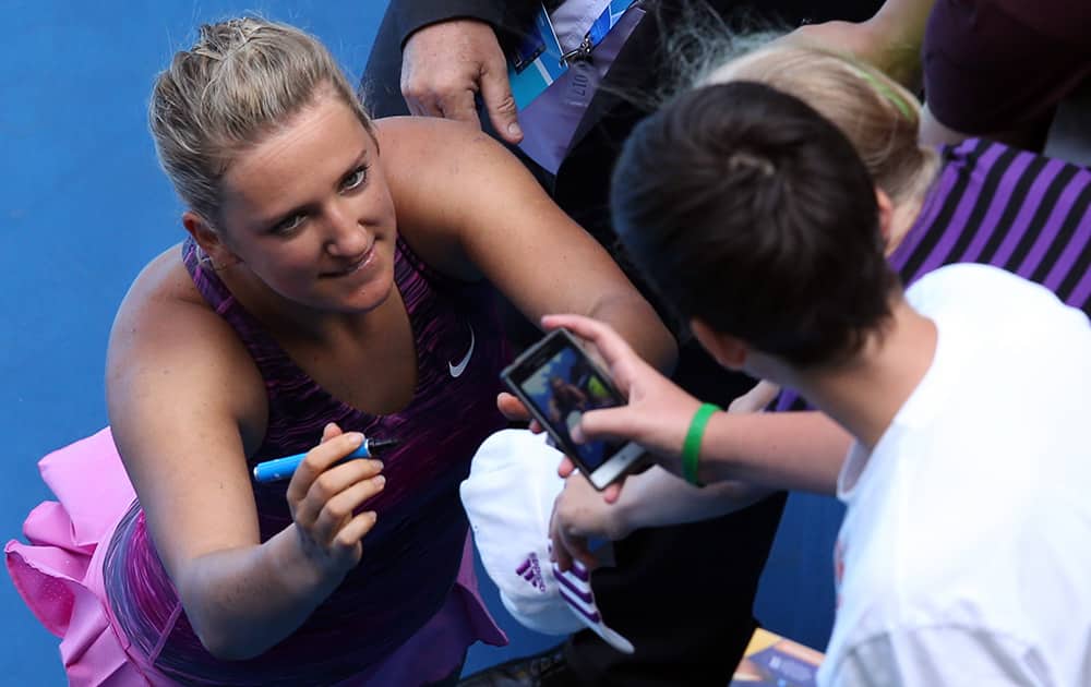 Victoria Azarenka of Belarus poses for a picture taken by a fan after her fourth round win over Sloane Stephens of the U.S. at the Australian Open tennis championship in Melbourne, Australia.