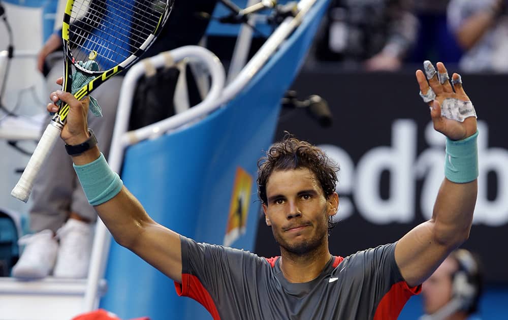 Rafael Nadal of Spain celebrates after defeating Kei Nishikori of Japan during their fourth round match at the Australian Open tennis championship in Melbourne, Australia.