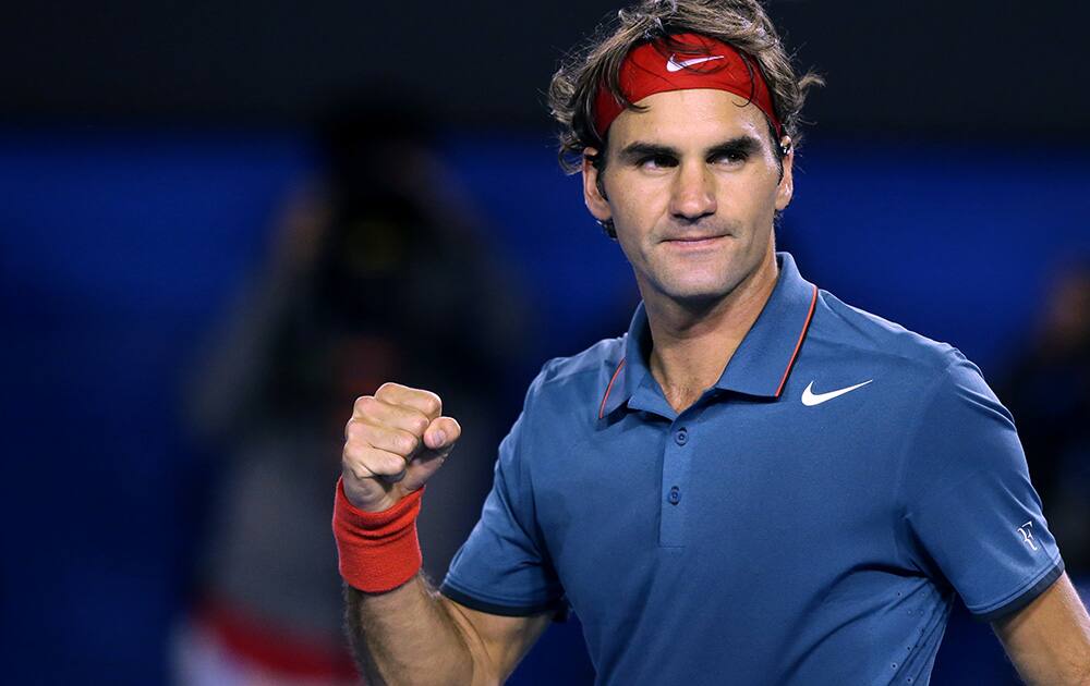 Roger Federer of Switzerland celebrates after defeating Jo-Wilfried Tsonga of France during their fourth round match at the Australian Open tennis championship in Melbourne, Australia.