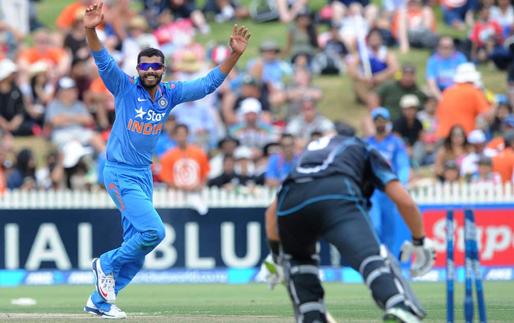 India’s Virat Kohli, left, celebrates believing New Zealand's Ross Taylor has been stumped off his bowling in the second one-day International cricket match at Seddon Park in Hamilton, New Zealand.