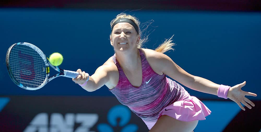 Victoria Azarenka of Belarus makes a forehand return to Agnieszka Radwanska of Poland during their quarterfinal at the Australian Open tennis championship in Melbourne.