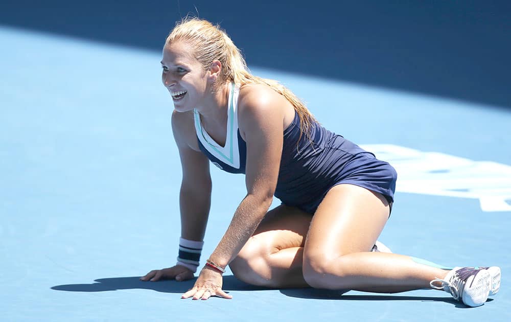 Dominika Cibulkova of Slovakia celebrates after defeating Simona Halep of Romania in their quarterfinal at the Australian Open tennis championship in Melbourne.