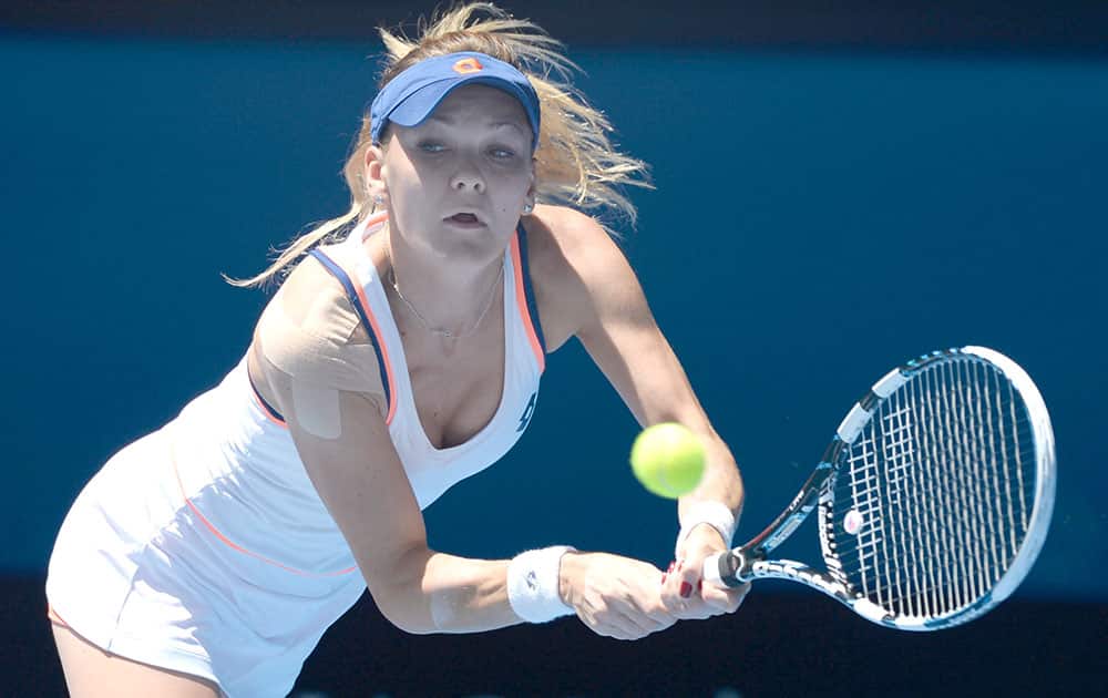 Agnieszka Radwanska of Poland makes a backhand return to Victoria Azarenka of Belarus during their quarterfinal at the Australian Open tennis championship in Melbourne.