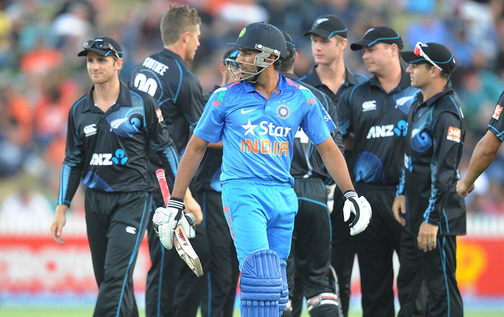 India’s Rohit Sharma looks back after being dismissed by New Zealand's Tim Southee for 20 in the second one day International cricket match at Seddon Park in Hamilton, New Zealand.