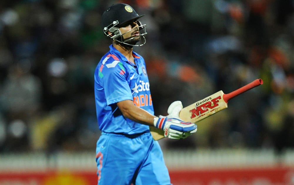 India’s Virat Kohli walks, out for 78 against New Zealand during their second one-day international cricket match, at Seddon Park, in Hamilton, New Zealand.