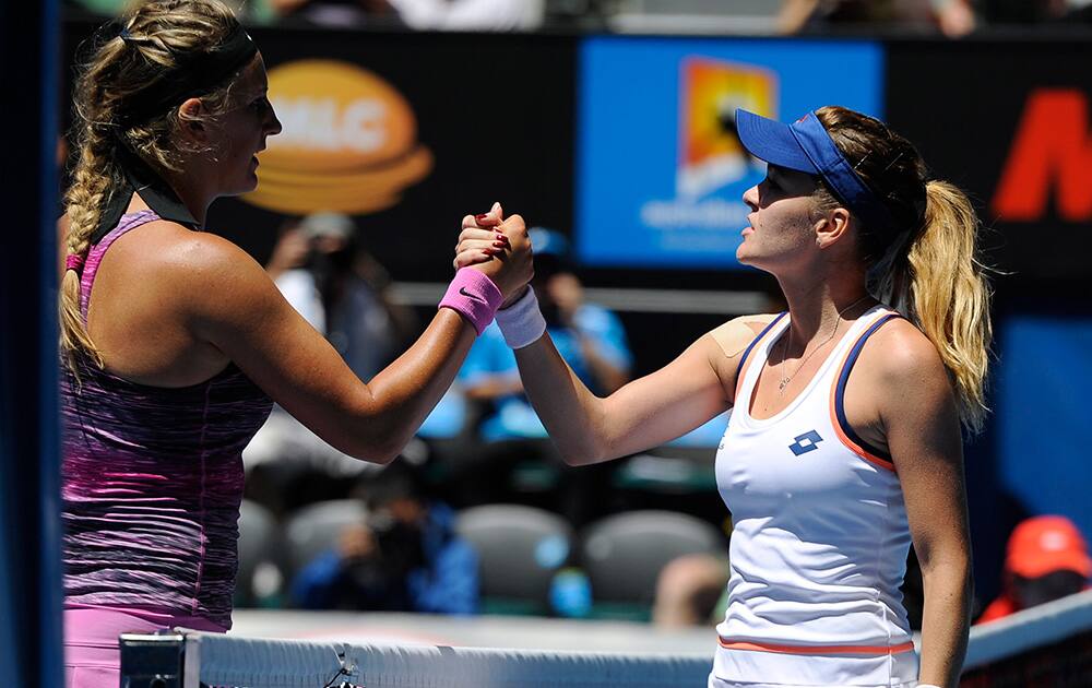 Agnieszka Radwanska of Poland, right, shakes hands with Victoria Azarenka of Belarus at the net after Radwanska won their quarterfinal at the Australian Open tennis championship in Melbourne, Australia.