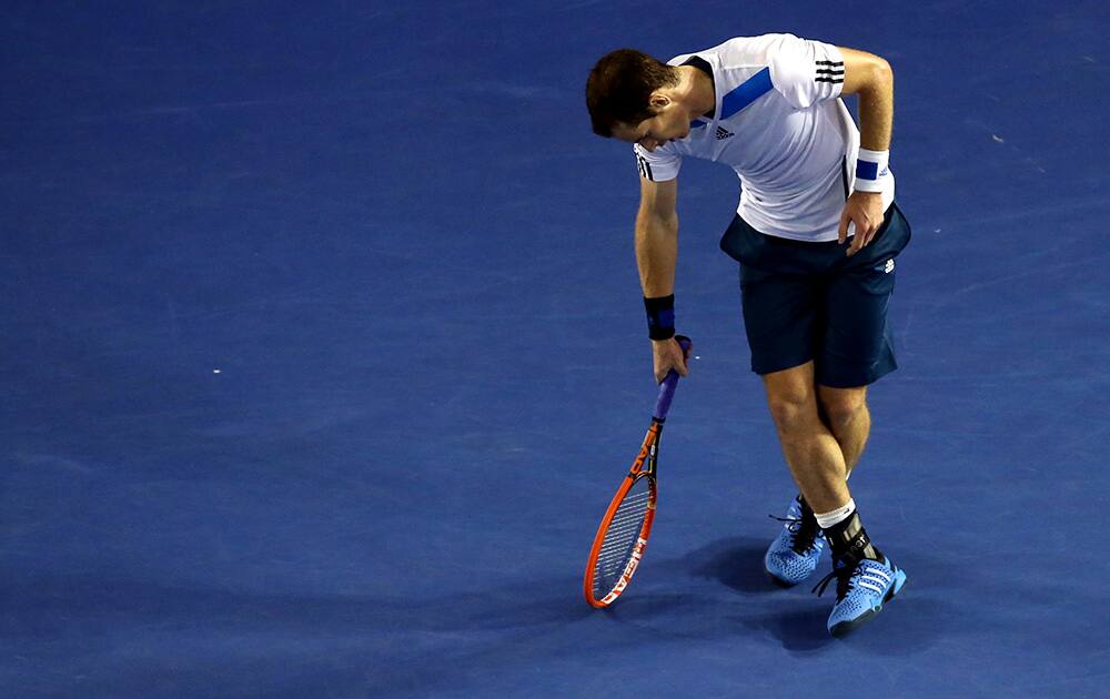 Andy Murray of Britain reacts after losing a point to Roger Federer of Switzerland during their quarterfinal at the Australian Open tennis championship in Melbourne, Australia.