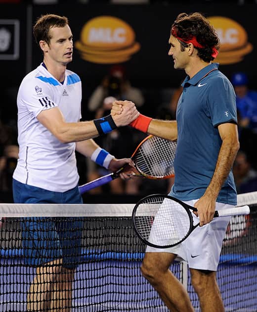 Roger Federer of Switzerland, right, shakes hands with Andy Murray of Britain at the net after Federer won their quarterfinal at the Australian Open tennis championship in Melbourne, Australia.